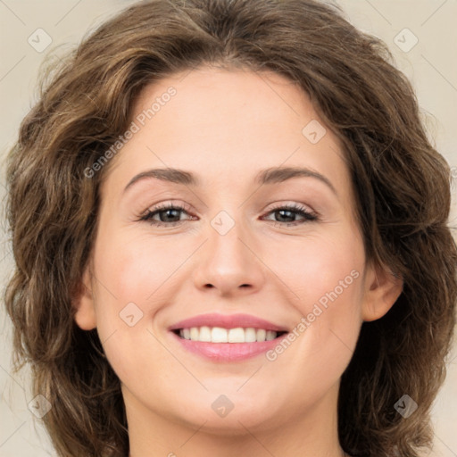 Joyful white young-adult female with long  brown hair and green eyes