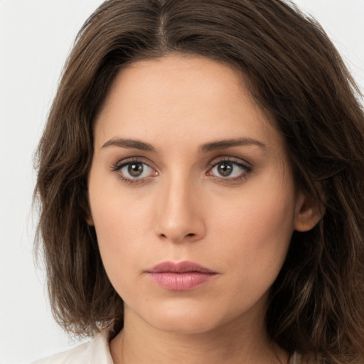 Neutral white young-adult female with medium  brown hair and brown eyes