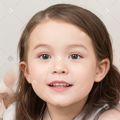 Joyful white child female with medium  brown hair and brown eyes