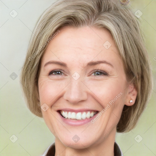 Joyful white adult female with medium  brown hair and grey eyes