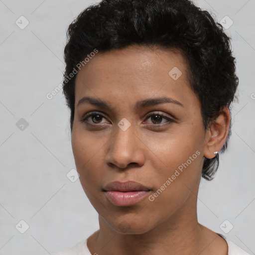 Joyful latino young-adult female with short  brown hair and brown eyes