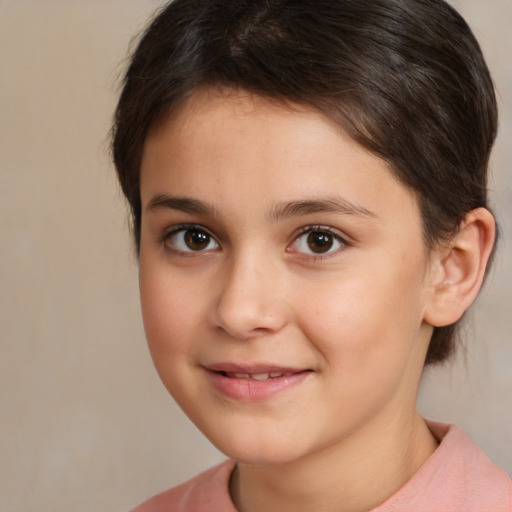 Joyful white child female with short  brown hair and brown eyes