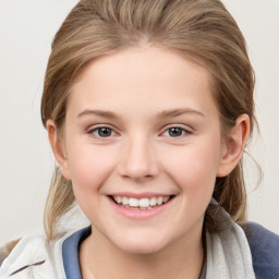 Joyful white child female with medium  brown hair and grey eyes