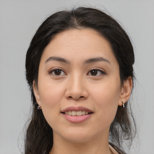 Joyful asian young-adult female with medium  brown hair and brown eyes