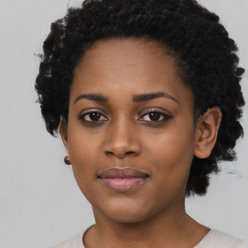 Neutral black young-adult female with short  black hair and brown eyes