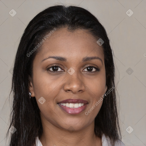 Joyful black young-adult female with long  brown hair and brown eyes