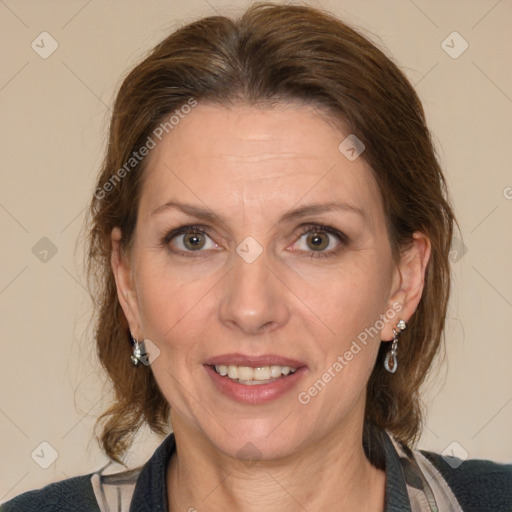 Joyful white adult female with medium  brown hair and blue eyes