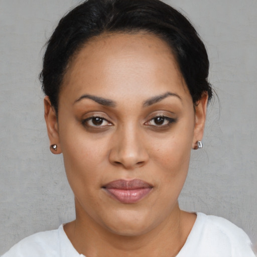 Joyful latino young-adult female with short  brown hair and brown eyes