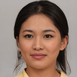 Joyful asian young-adult female with medium  brown hair and brown eyes