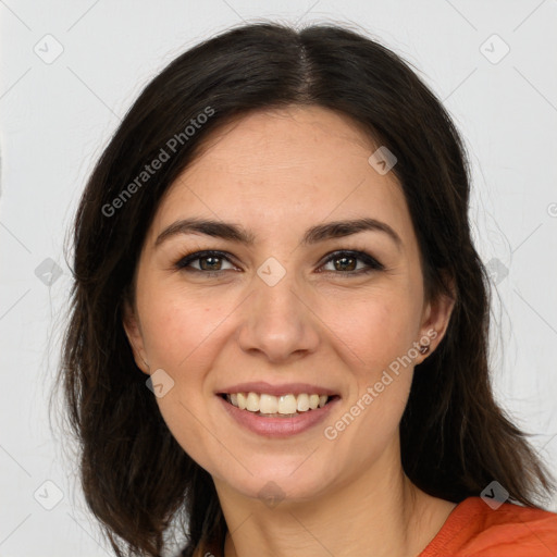 Joyful white young-adult female with long  brown hair and brown eyes