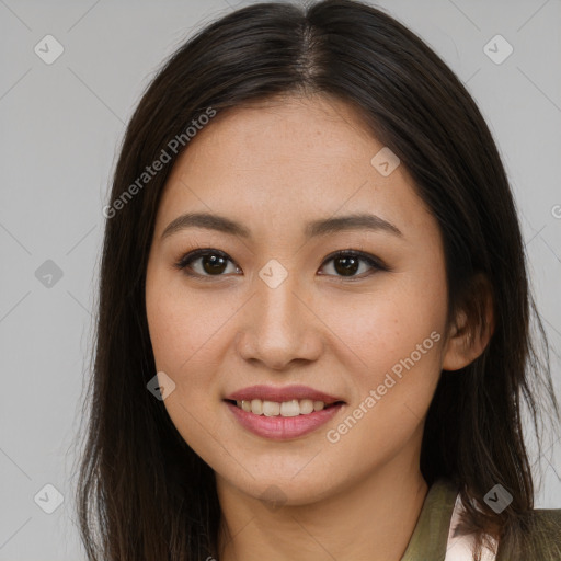 Joyful asian young-adult female with long  brown hair and brown eyes