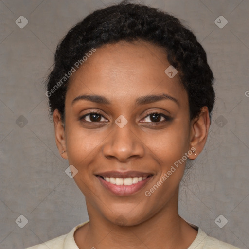 Joyful black young-adult female with short  black hair and brown eyes