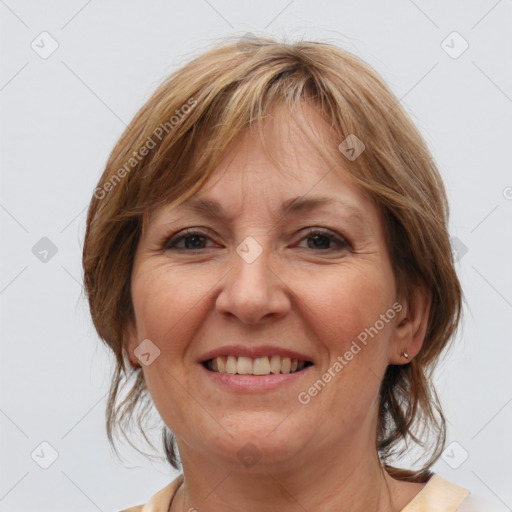 Joyful white adult female with medium  brown hair and grey eyes