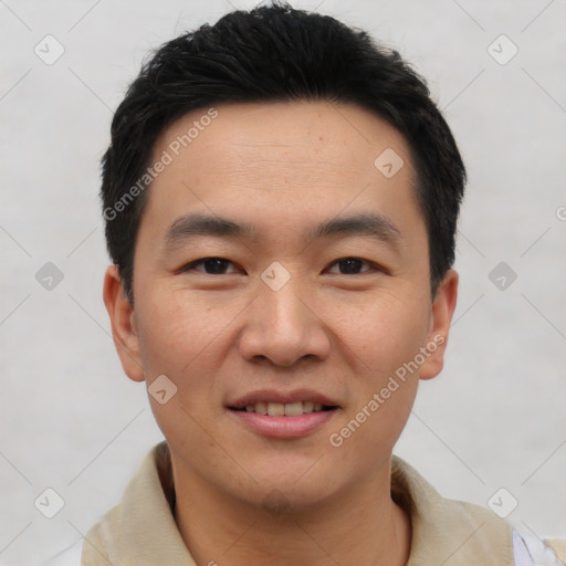 Joyful asian young-adult male with short  black hair and brown eyes