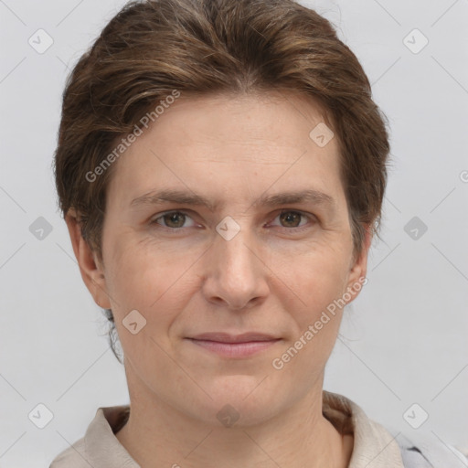 Joyful white adult female with short  brown hair and grey eyes