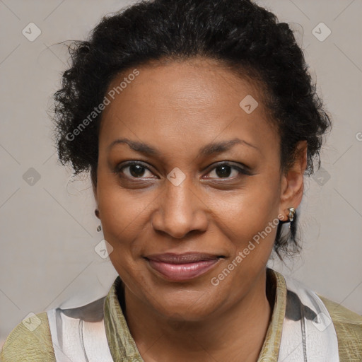 Joyful black adult female with medium  brown hair and brown eyes