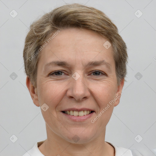 Joyful white adult female with short  brown hair and grey eyes