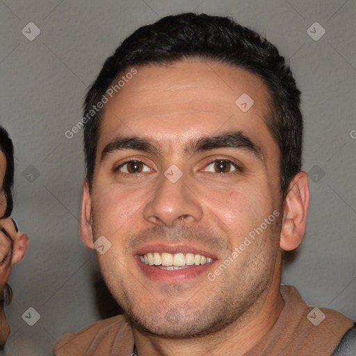 Joyful white young-adult male with short  black hair and brown eyes