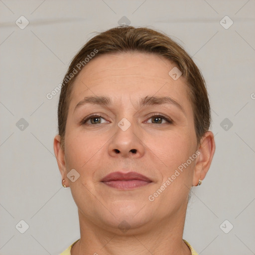 Joyful white adult female with short  brown hair and brown eyes