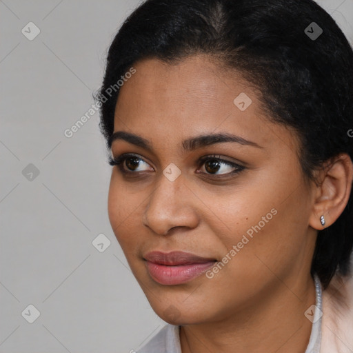 Joyful latino young-adult female with short  brown hair and brown eyes