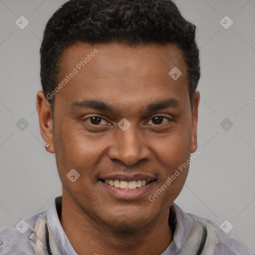 Joyful black young-adult male with short  black hair and brown eyes