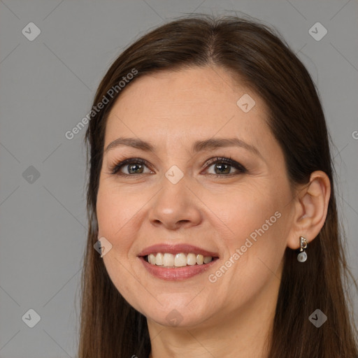 Joyful white adult female with long  brown hair and brown eyes