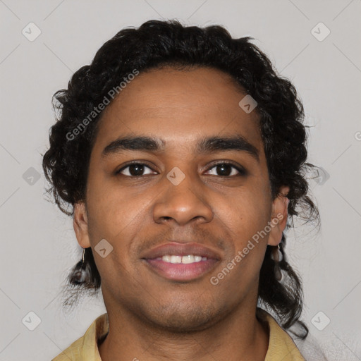 Joyful black young-adult male with short  black hair and brown eyes