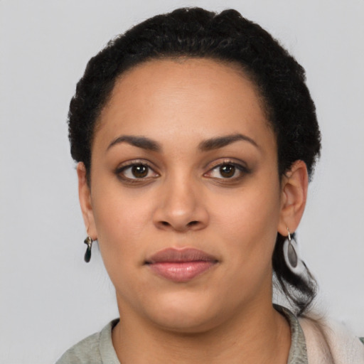 Neutral latino young-adult female with short  black hair and brown eyes