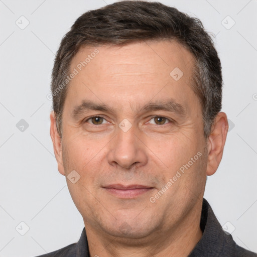 Joyful white adult male with short  brown hair and brown eyes