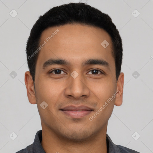 Joyful latino young-adult male with short  black hair and brown eyes