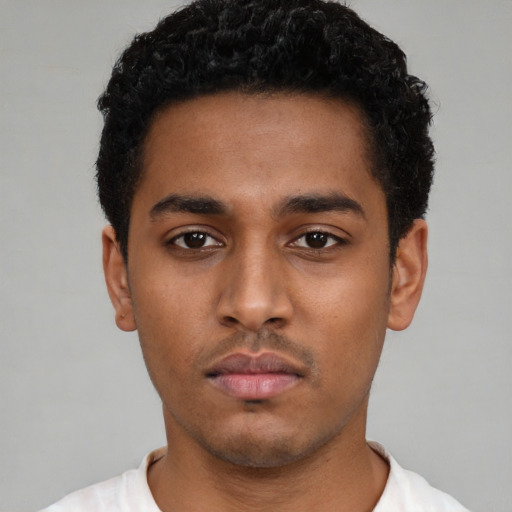 Neutral black young-adult male with short  black hair and brown eyes