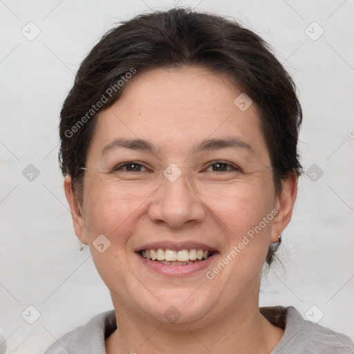 Joyful white adult female with short  brown hair and brown eyes