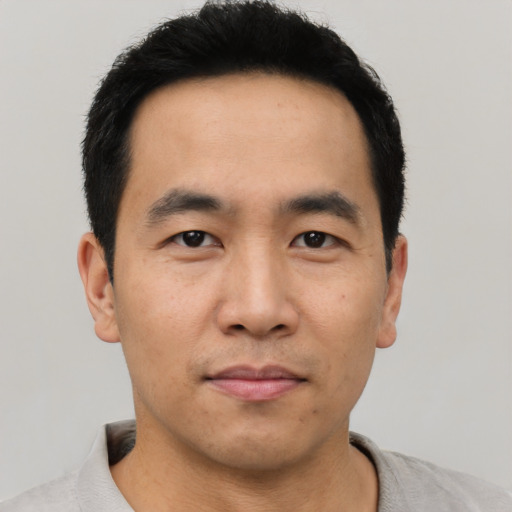 Neutral asian young-adult male with short  black hair and brown eyes