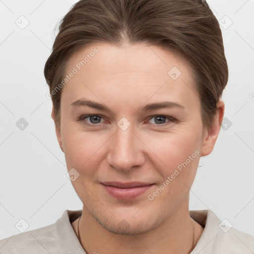 Joyful white young-adult female with short  brown hair and grey eyes