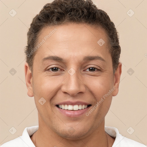 Joyful white adult male with short  brown hair and brown eyes