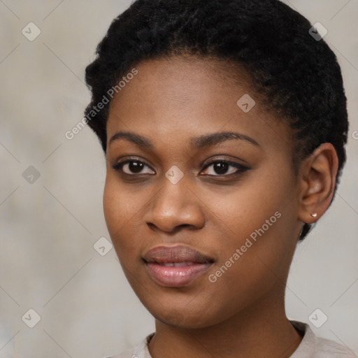 Joyful black young-adult female with short  black hair and brown eyes