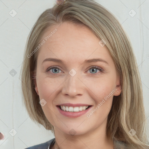 Joyful white young-adult female with long  brown hair and blue eyes