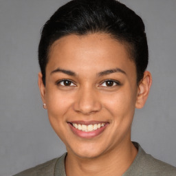 Joyful latino young-adult female with short  brown hair and brown eyes