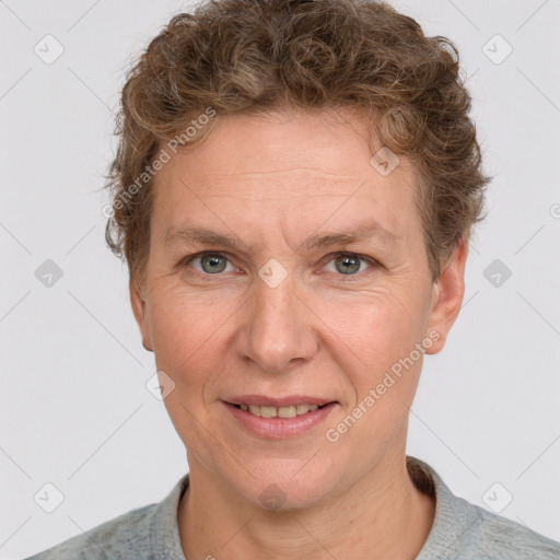 Joyful white adult female with short  brown hair and grey eyes