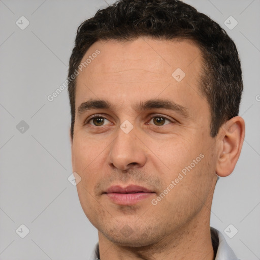 Joyful white adult male with short  brown hair and brown eyes