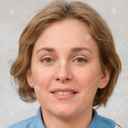 Joyful white young-adult female with medium  brown hair and blue eyes