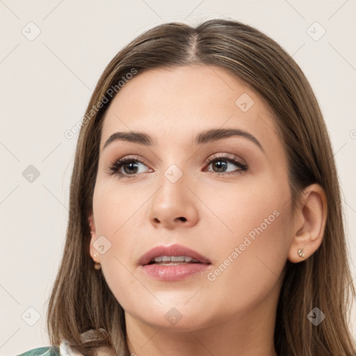 Neutral white young-adult female with long  brown hair and brown eyes