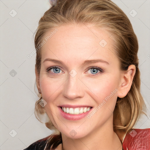 Joyful white young-adult female with medium  brown hair and blue eyes