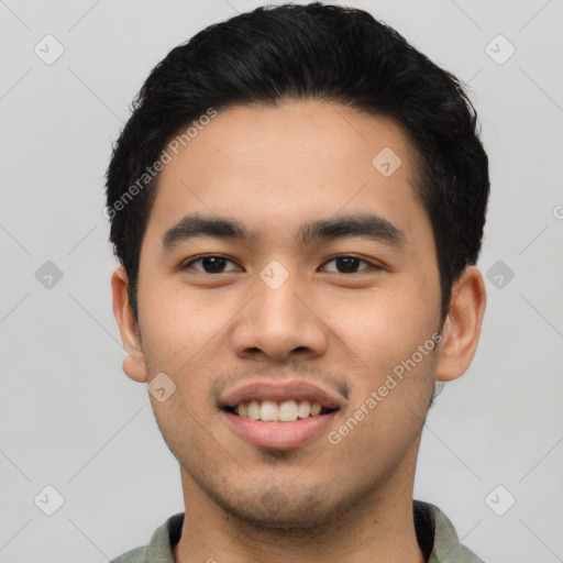 Joyful asian young-adult male with short  black hair and brown eyes