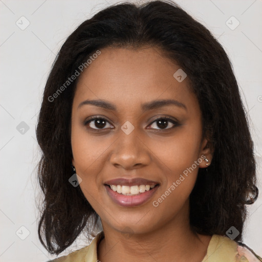 Joyful black young-adult female with long  brown hair and brown eyes