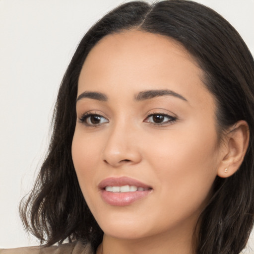 Joyful white young-adult female with long  black hair and brown eyes