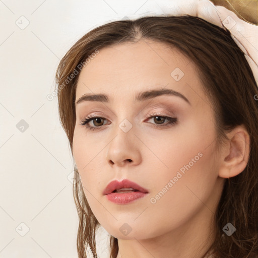 Neutral white young-adult female with long  brown hair and brown eyes