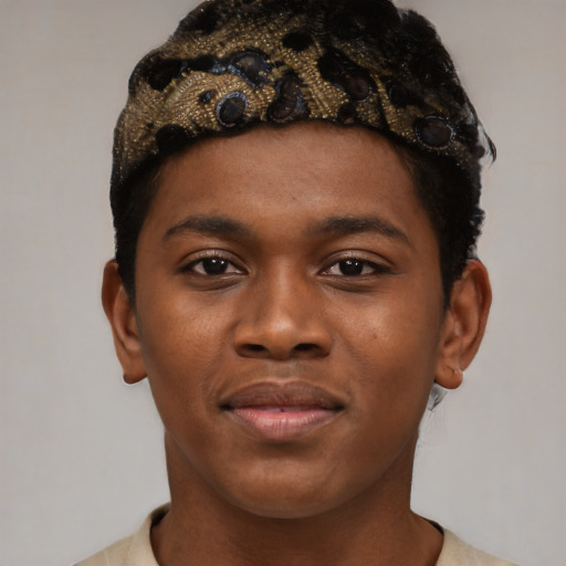 Joyful black young-adult male with short  black hair and brown eyes