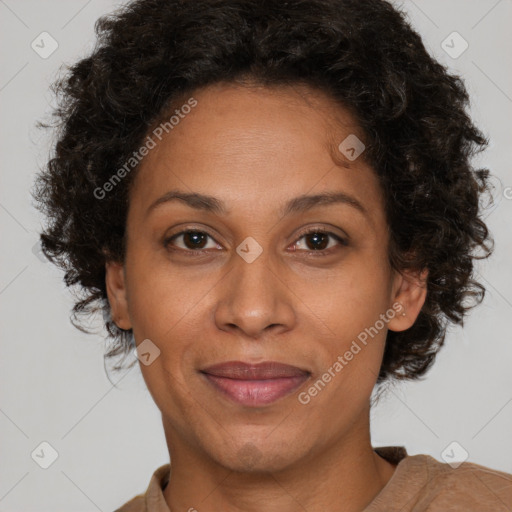 Joyful black adult female with short  brown hair and brown eyes