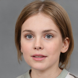 Neutral white young-adult female with medium  brown hair and grey eyes